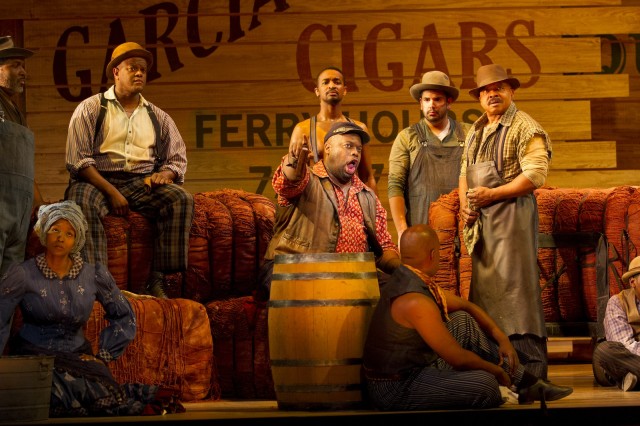 Morris Robinson as Joe (center, in red shirt) and the company of Show Boat. Photo by Scott Suchman.